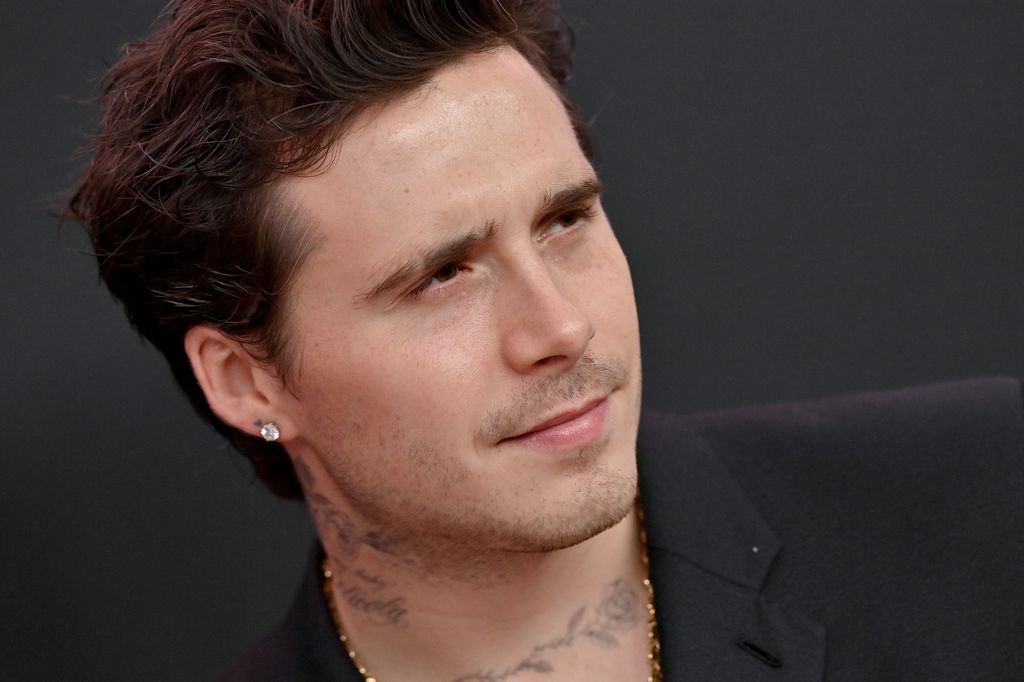 brooklyn beckham at premiere in suit