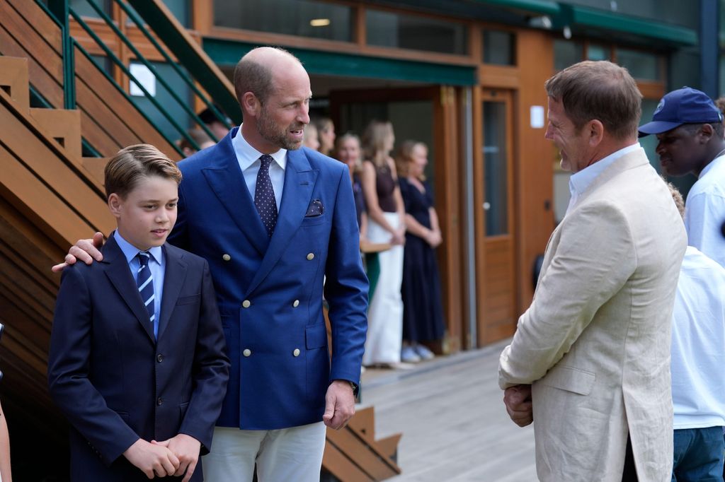 Prince George beside william talking to steve backshall