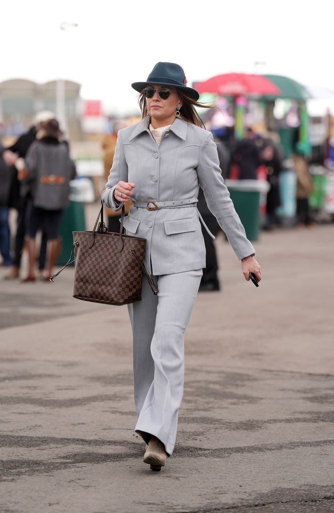 A racegoer arrives on day three of the 2025 Cheltenham Festival at Cheltenham Racecourse. Picture date: Thursday March 13, 2025. (Photo by Joe Giddens/PA Images via Getty Images)