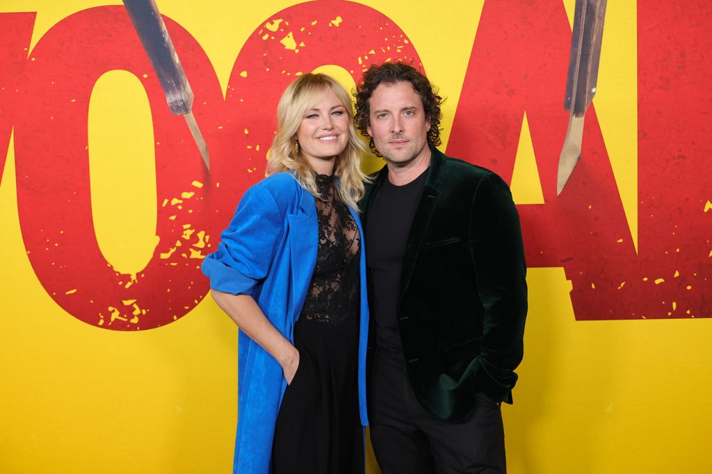 Malin Akerman and husband Jack hug on red carpet