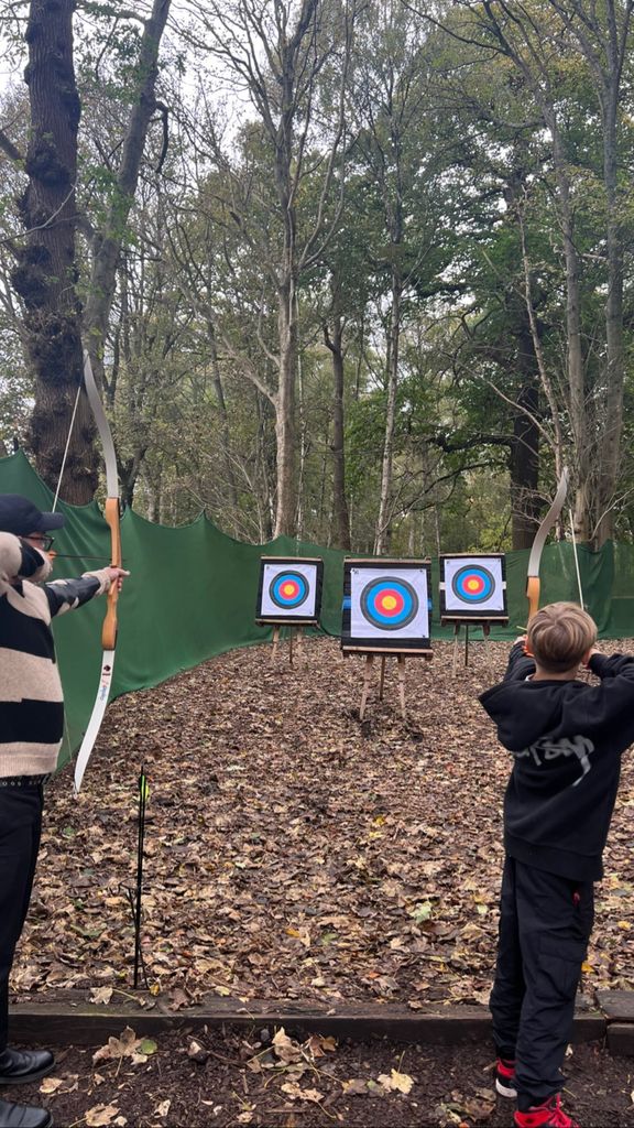 Matt Willis and his son practicing archery
