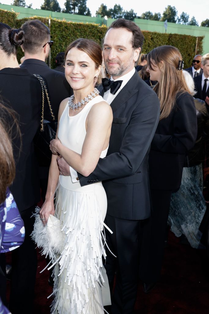 Keri Russell and Matthew Rhys hugging at the Golden Globes