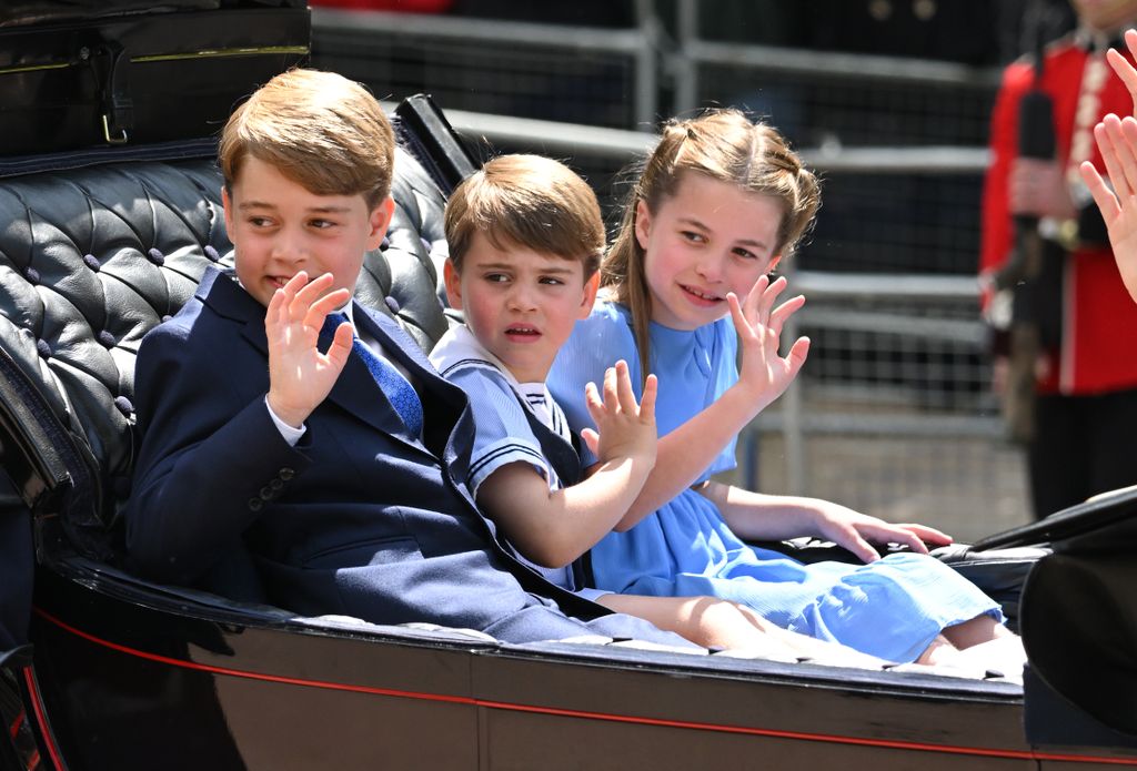 Prince George, Prince Louis and Princess Charlotte waving during Trooping the Colour 