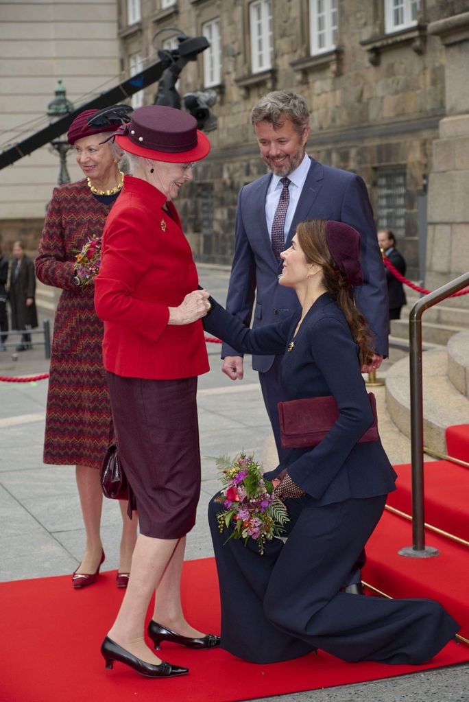 Princess Mary curtsying to Queen Margrethe at the  opening of Danish Parliament in 2021