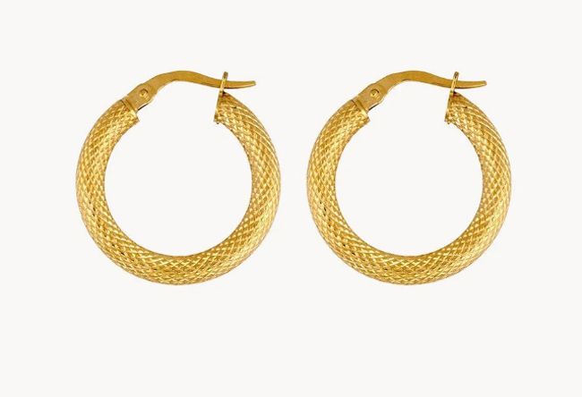 a pair of thick gold hoop earrings