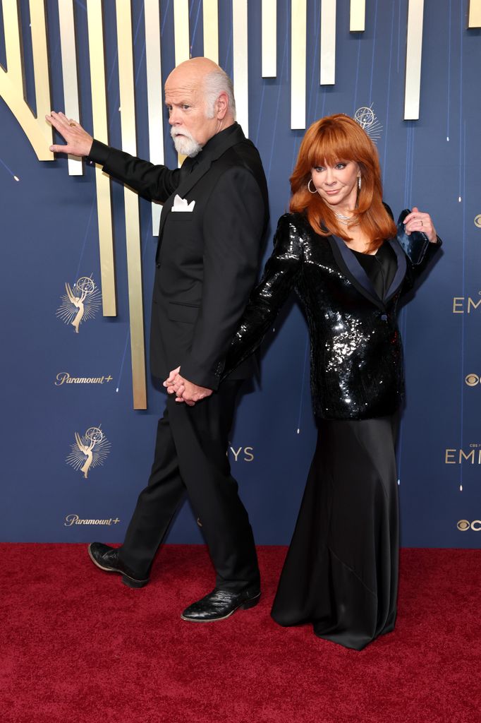 Rex Linn and Reba McEntire attends the 77th Primetime Emmy Awards at Peacock Theater on September 14, 2025 in Los Angeles, California.