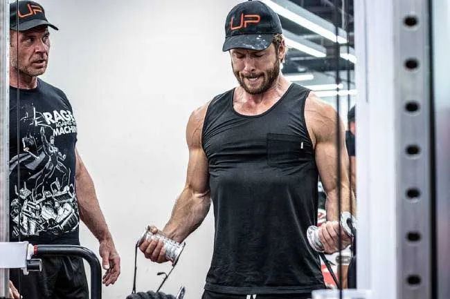 Glen Powell breaks a sweat as he sculpts his Top Gun physique with trainer Nick Mitchell