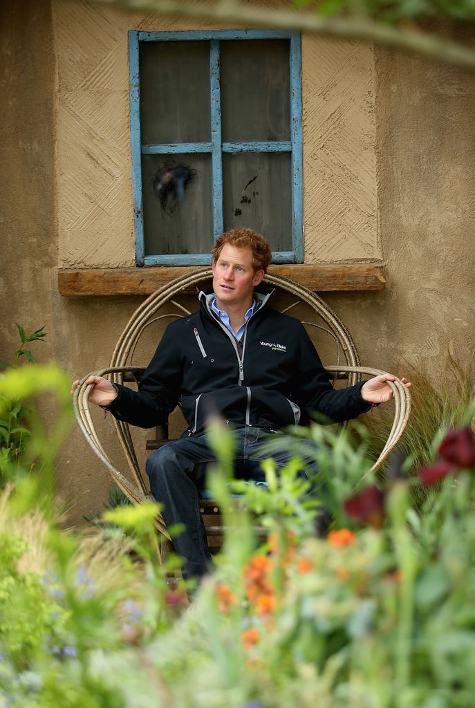 Prince Harry sitting in a Basotho chair at Chelsea Flower Show