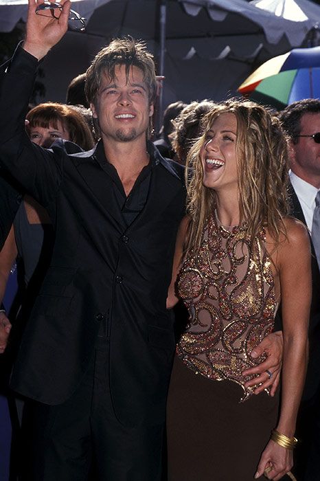 Jennifer Aniston wearing a sequin bodice dress with Brad Pitt