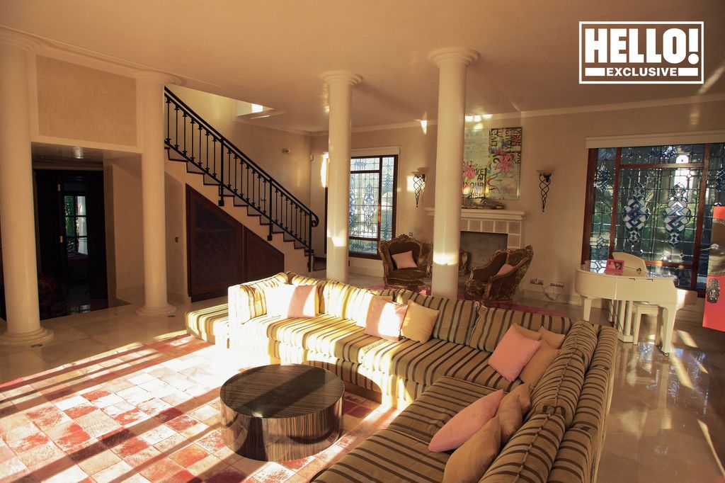 CBB star Gary Goldsmith's Ibiza home living room with striped L shaped sofa and white columns