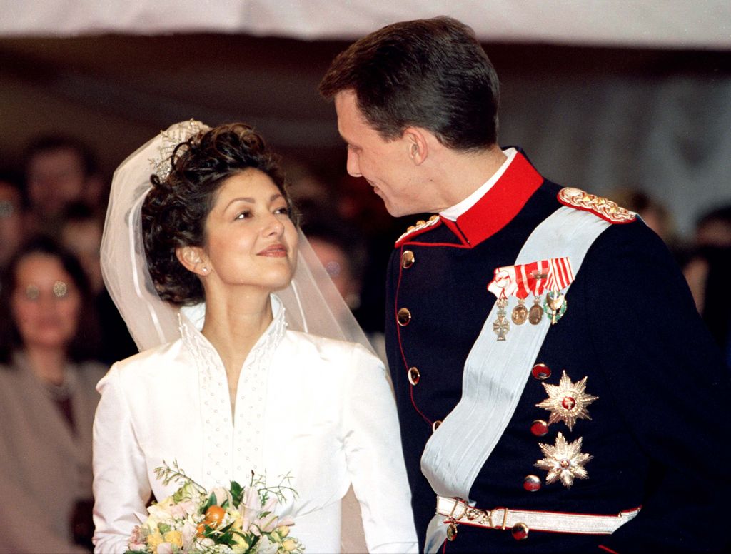 Prince Joachim & Princess Alexandra Of Denmark looking fondly at each other on their wedding day