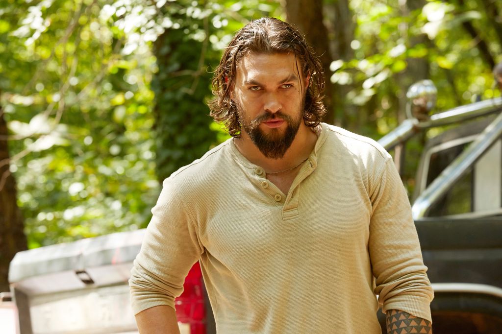 close-up of man standing in woods