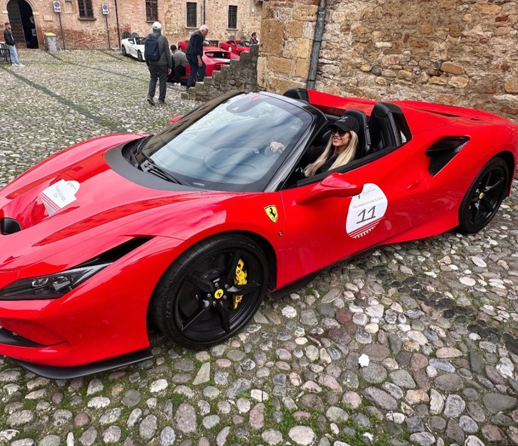 Photo shared by Christina Hall on Instagram October 2024 of herself driving a red Ferrari during a trip to Paris, France