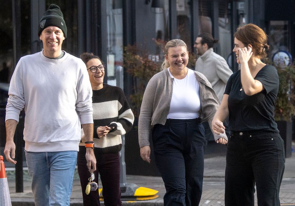 Princess Eugenie and a group of friends laughing with Jack Brooksbank