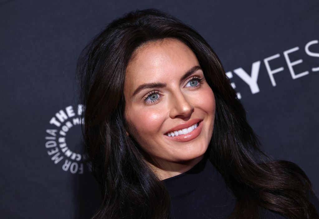 Brianna Ruffalo smiling, blue eyes and black hair worn loose