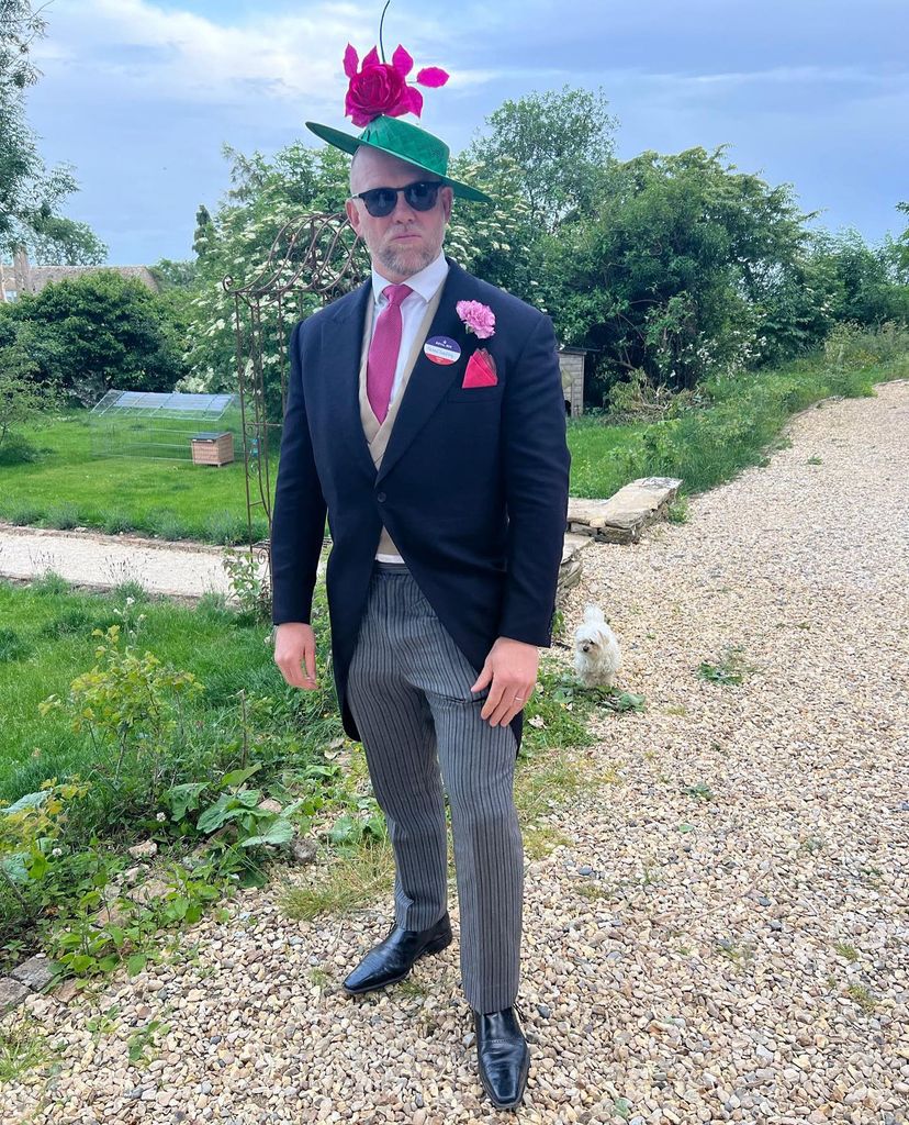 mike tindall wearing suit and pink and green women's hat