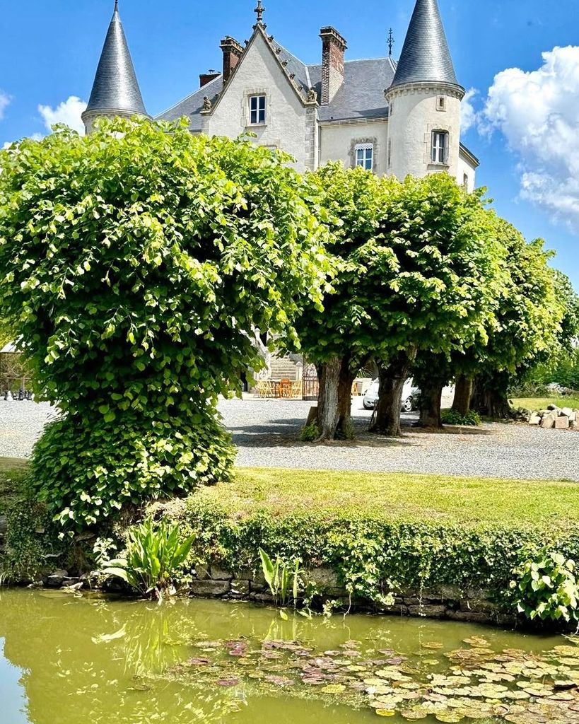 Dick and Angel Strawbridge's pond outside their chateau home