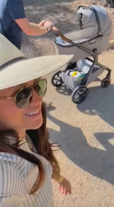 harry pushing lilibet in pram with meghan markle
