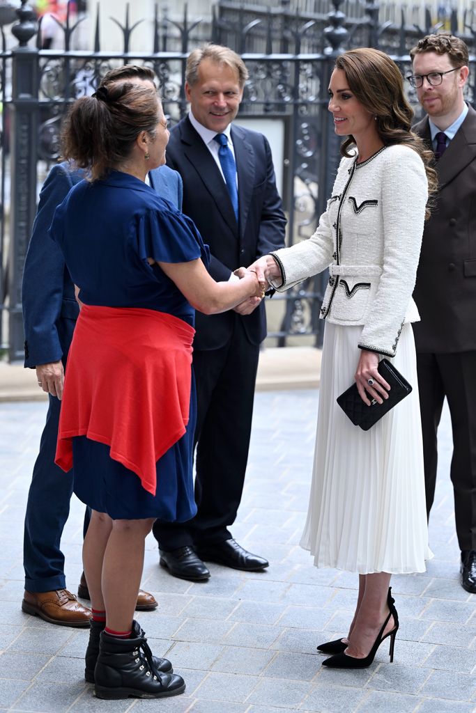 Kate Middleton shaking hands with award-winning artist Tracey Emin who was commissioned to create an artwork for the Gallery's new doors