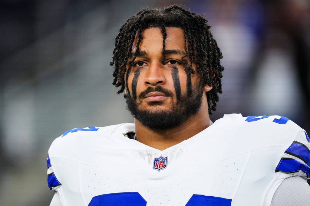 Marshawn Kneeland #94 of the Dallas Cowboys looks on from the sideline during the national anthem prior to an NFL football game against the Tampa Bay Buccaneers at AT&T Stadium on December 22, 2024 in Arlington, Texas