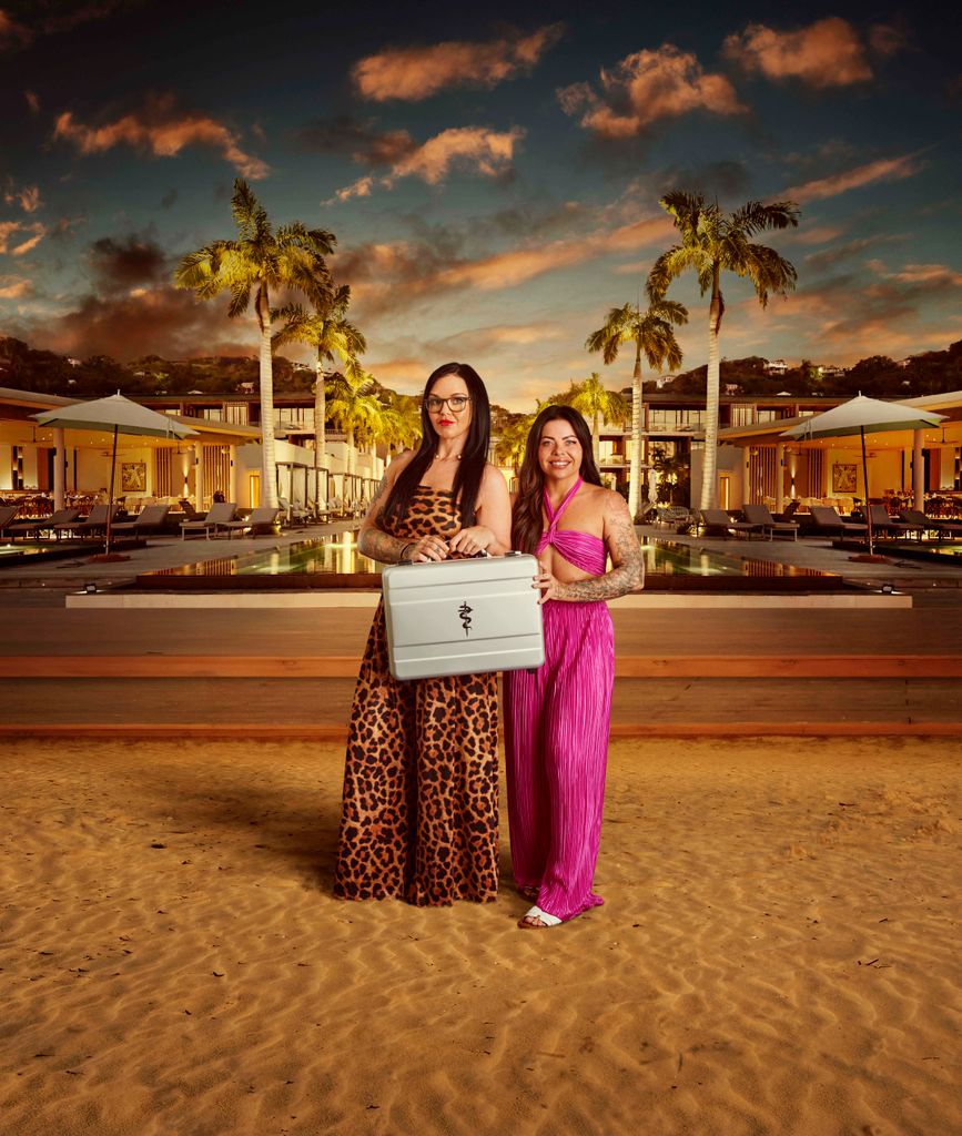 two women on beach with a briefcase