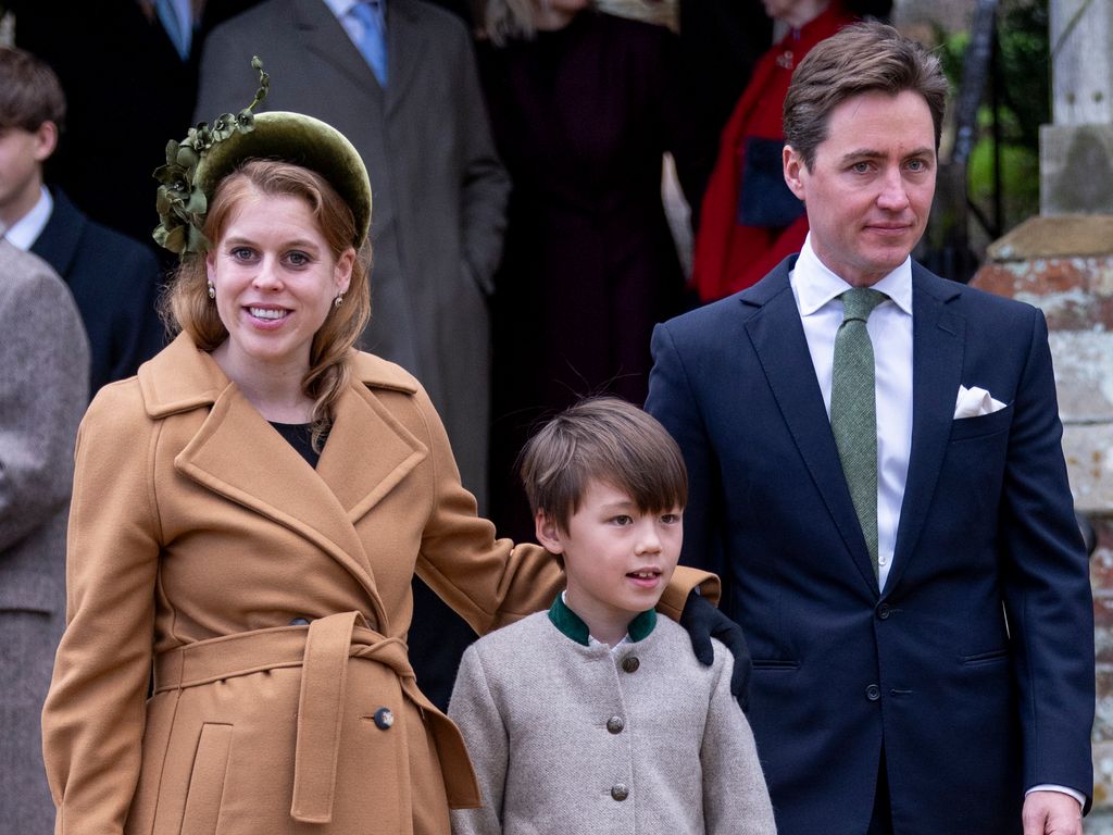 Princess Beatrice with her arm around Wolfie, Edoardo Mapelli Mozzi stands with them