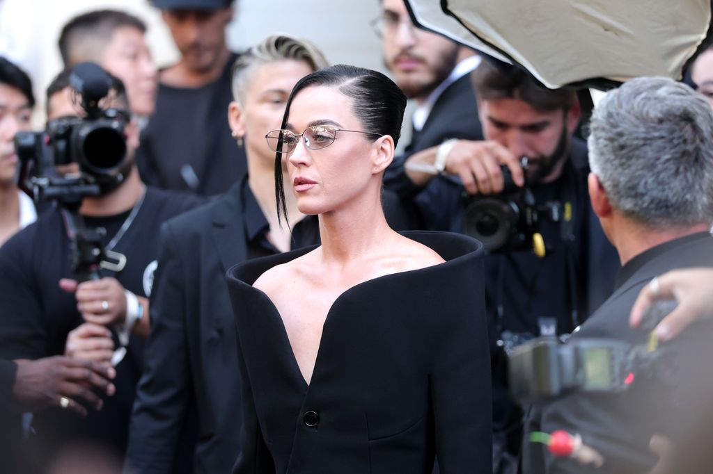 katy perry in glasses and black dress