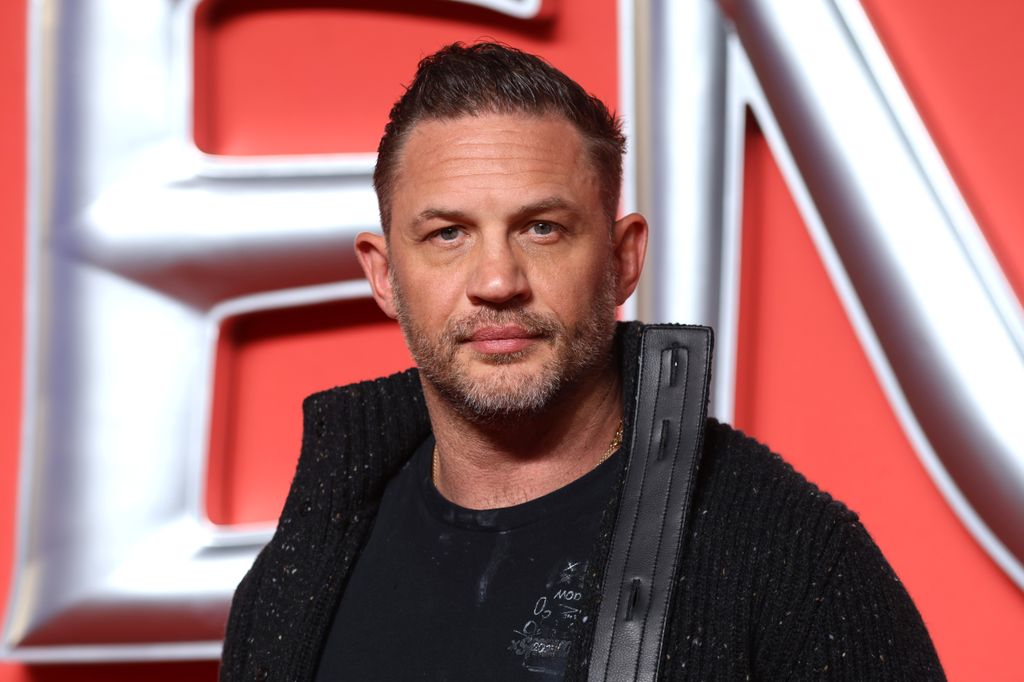 photo of tom hardy wearing black at venom premiere