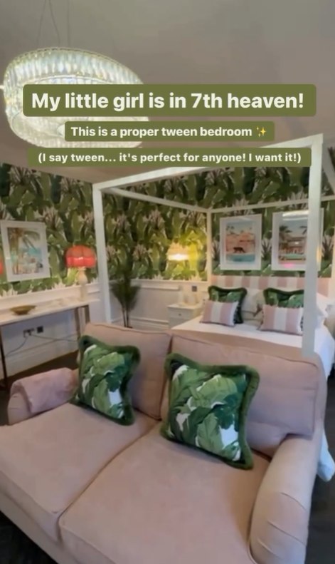 Screenshot of bedroom with white four poster bed, pink sofa and green wallpaper 