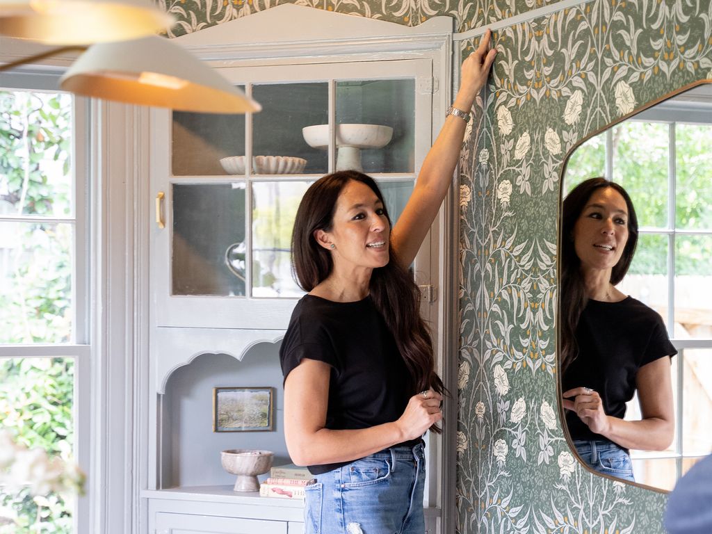 Joanna Gaines hangs wallpaper