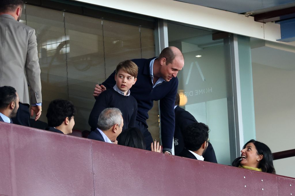 Prince William with his son, Prince George, watching Aston Villa at Villa Park