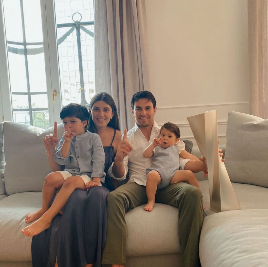 Sergio Perez with wife Carola and their two children on a sofa