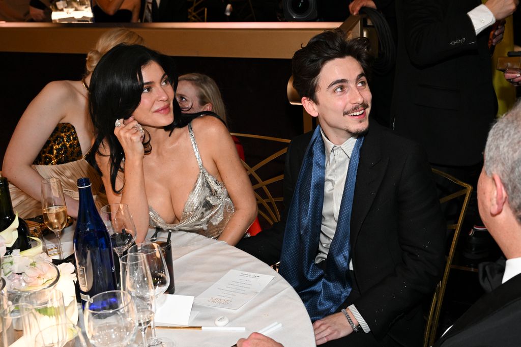 Kylie Jenner and Timothée Chalamet smiling at the 2025 golden globes