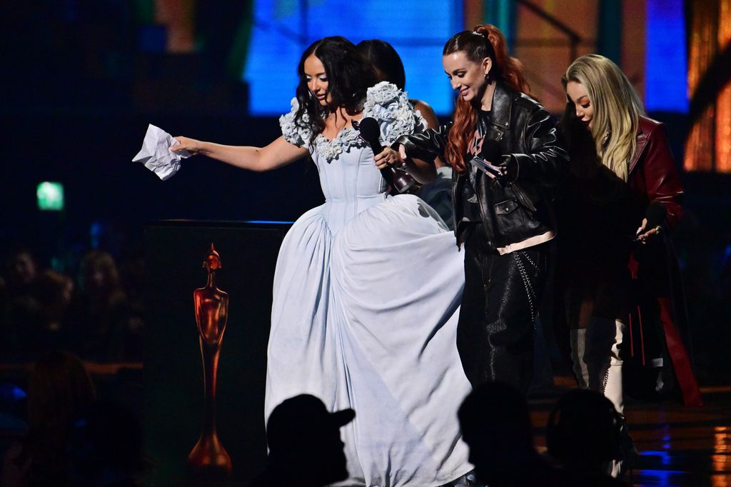 Jade Thirlwall in a blue dress with the Sugababes