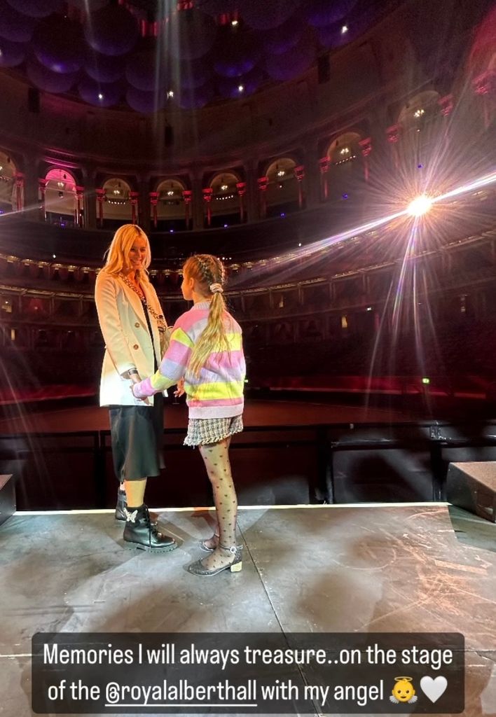 Nadiya Bychkova holding hands with daughter Mila on stage at the Royal Albert Hall