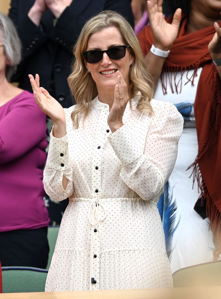 The Duchess of Edinburgh claps whilst watching a match on Wimbledon's Centre Court