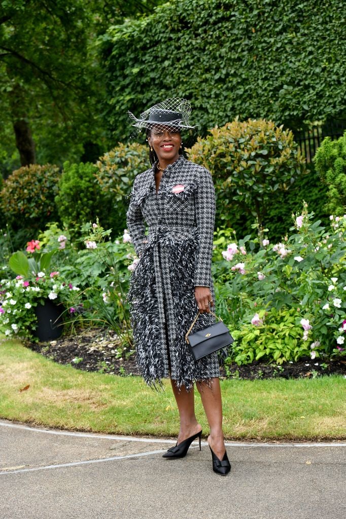 Susan Bender in a tweed coat dress with feather trim and netted hat at Royal Ascot.