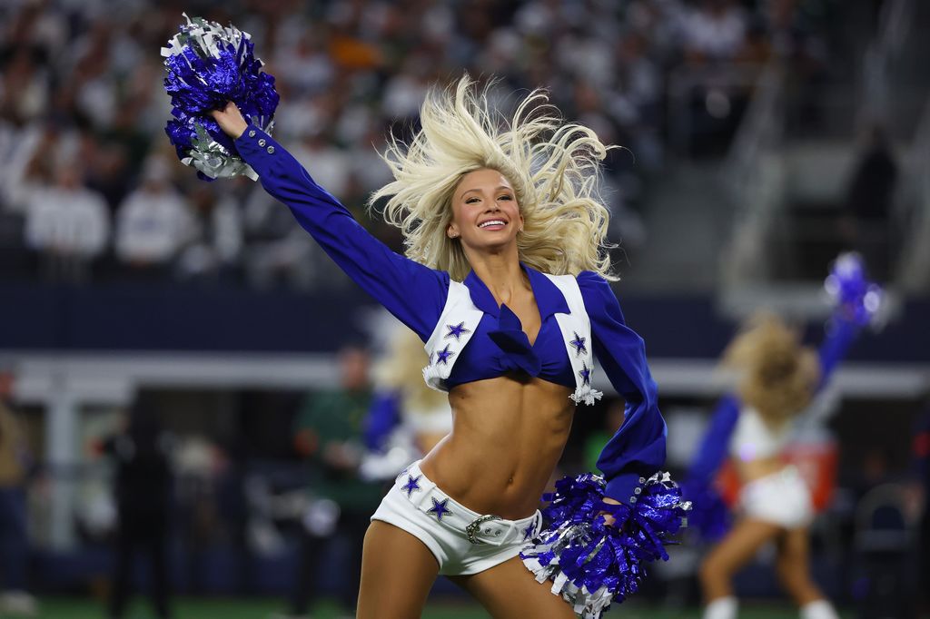 A cheerleader for the Dallas Cowboys performs during the first half of the NFC Wild Card Playoff game