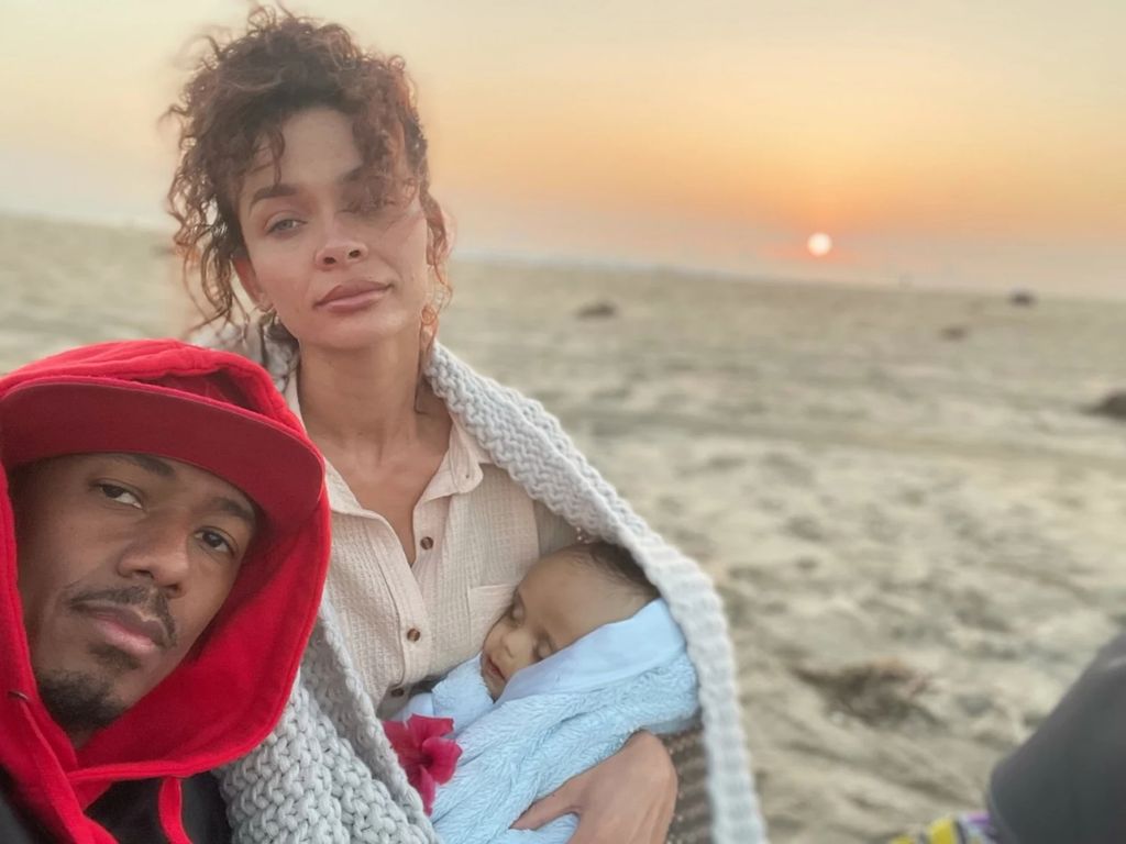 Nick Cannon and Alyssa Scott hold baby Zen on the beach days before his death