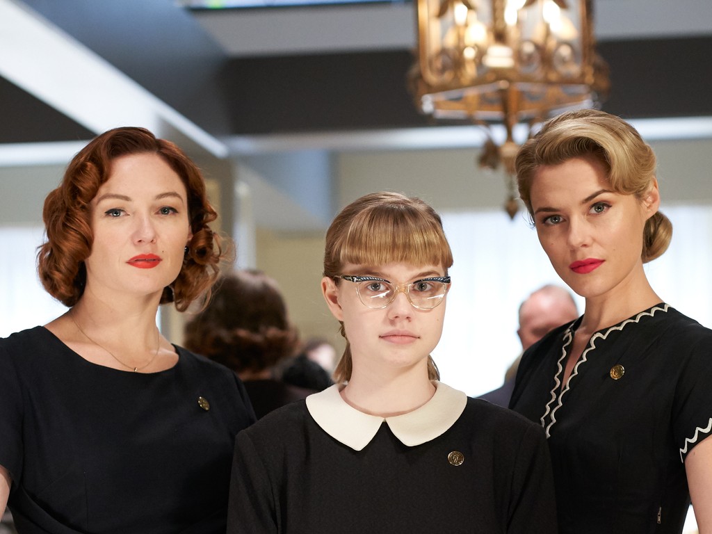 three women dressed in black