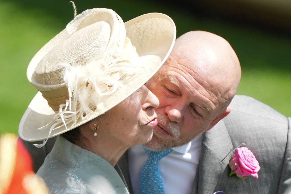 Mike Tindall kissing Princess Anne