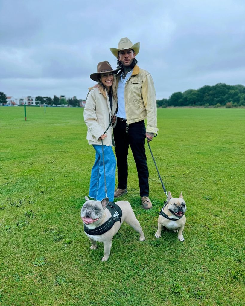 Pete and Jowita with dogs in field