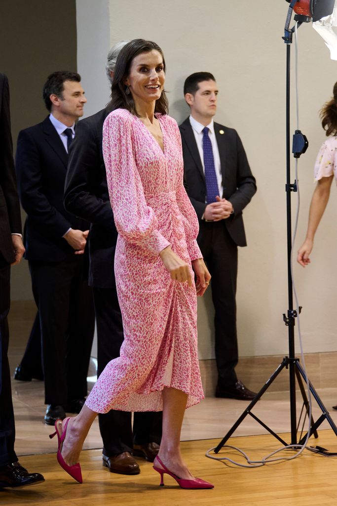 Queen Letizia walking in pink dress