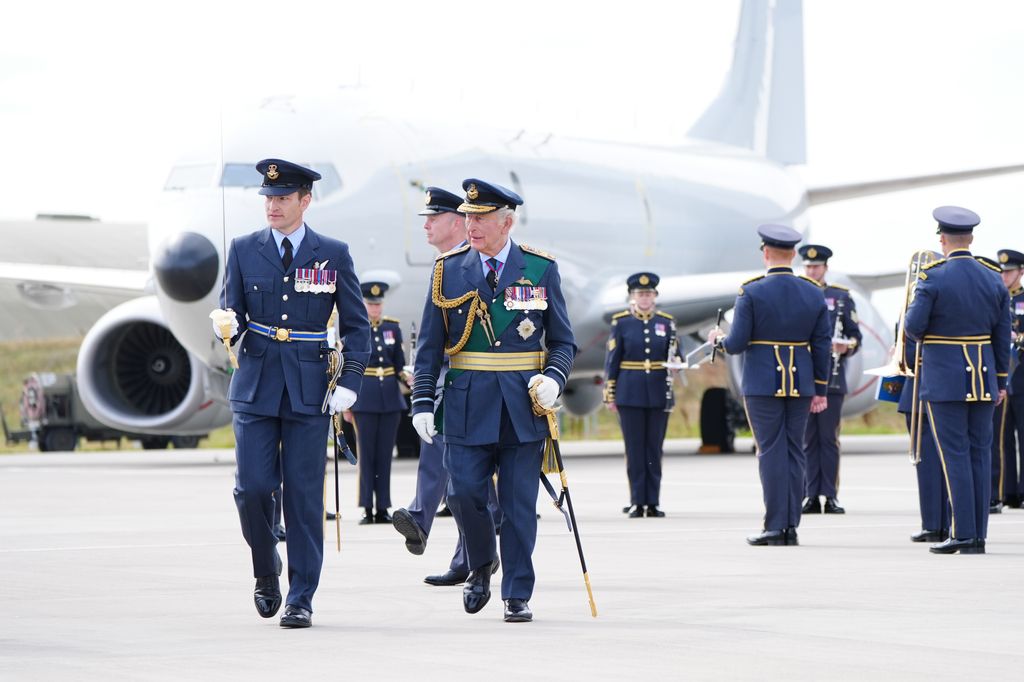 King Charles III inspects members of 42 (Torpedo Bomber) Squadron, during a visit to RAF Lossiemouth in Moray 
