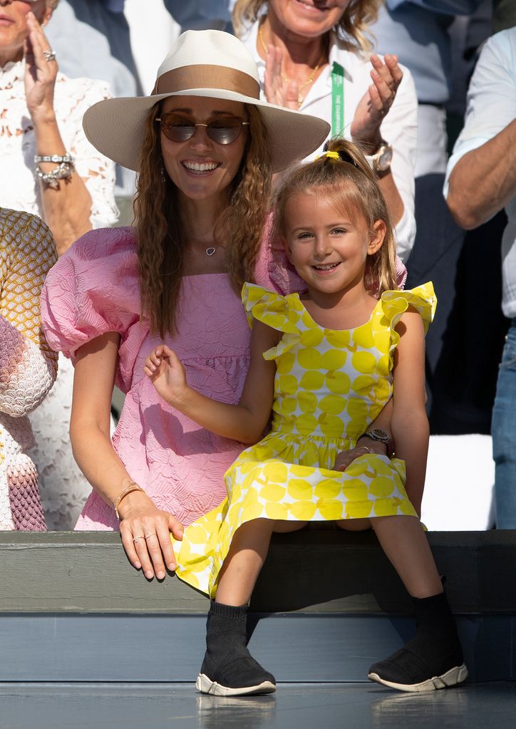 Jelena and Tara Djokovic watching tennis