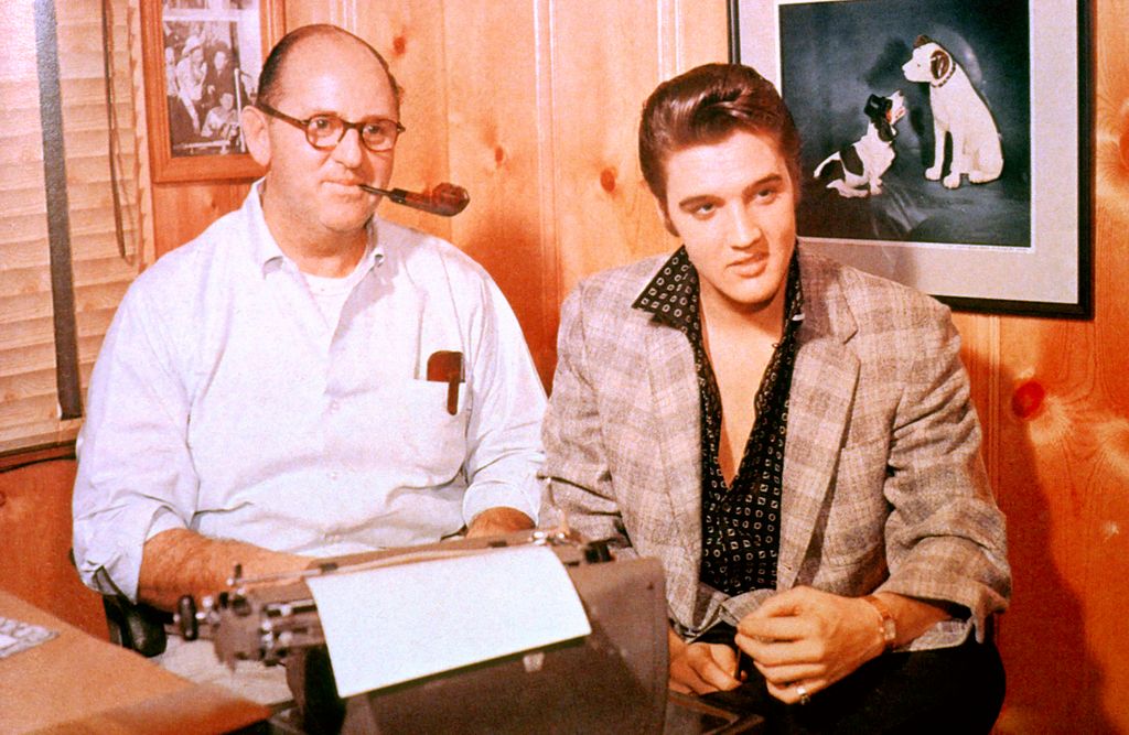 Photo of Colonel Tom PARKER and Elvis PRESLEY, with manager Colonel Tom Parker - posed, c.1956/1967