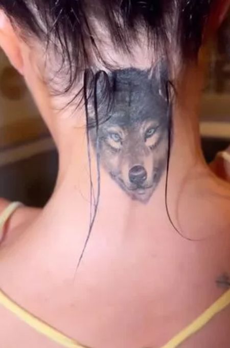 Tulisa's wolf tattoo on the back of her neck