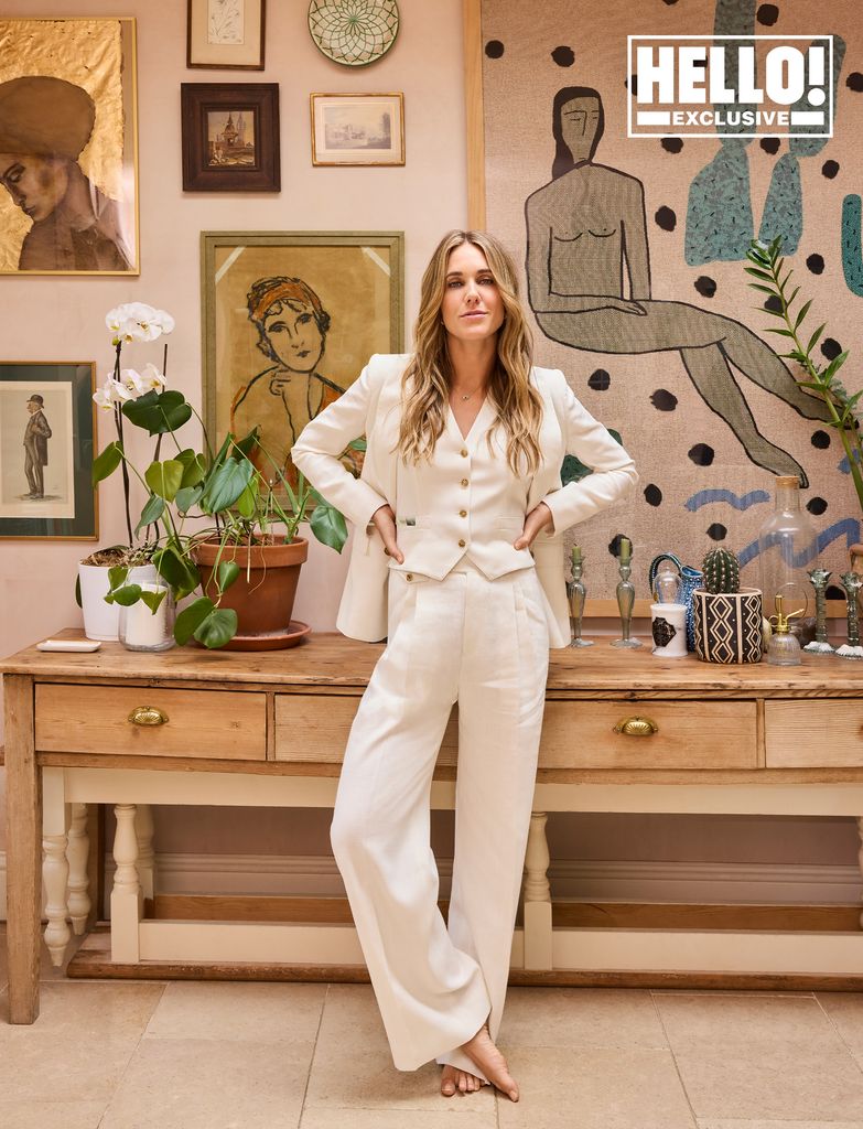 Designer Daisy Knatchbull in front of gallery wall at home in London