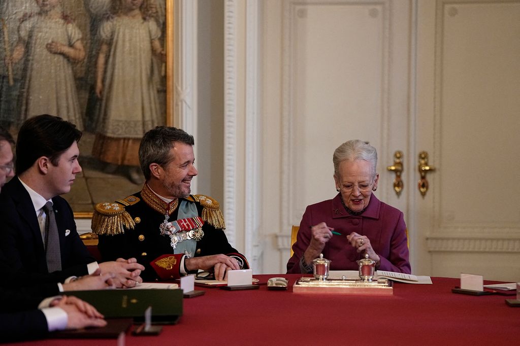Queen Margrethe signs a declaration of abdication