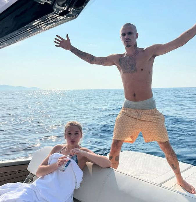 Harper Beckham pouting on a yacht next to brother Romeo